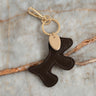 Bumpy Dog Bag Charm Cognac - Things I Like Things I Love